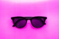 Stylish black sunglasses on a pink background Royalty Free Stock Photo