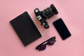 Stylish black sunglasses,smartphone,photo camera and notebook on Royalty Free Stock Photo