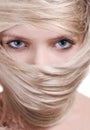 Stylish blonde woman close-up hair mask