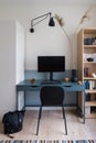 Stylish blue desk in simple study room Royalty Free Stock Photo