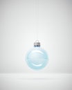 Stylish blue Glass Christmas bauble on white Studio background for winter holiday greeting card Royalty Free Stock Photo