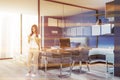 Stylish blue home office interior, woman Royalty Free Stock Photo