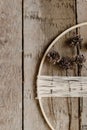 Stylish boho autumn wreath with dry flowers flat lay. Wooden hoop, thread and dry herbs on rustic wooden background. Modern floral Royalty Free Stock Photo