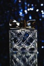 Stylish bottle of Female perfume over blue