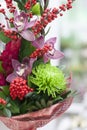 Original bouquet of flowers from gerberas, Burgundy roses, orchids, tulips Royalty Free Stock Photo