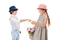 Stylish boy gives a girl basket of flowers