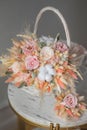 Stylish bridal bouquet of preserved flowers and lagurus with boutonniere. Dried and preserved flowers brides bouquet in