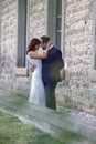 Stylish bride and groom at a park on their wedding day. Beautiful love story in nature, couple in love Royalty Free Stock Photo