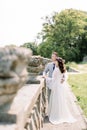 Stylish bride and groom. wedding couple. Happy bride and groom on their wedding day. Groom and Bride walking near old Royalty Free Stock Photo