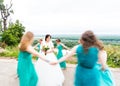 Stylish bridesmaids have fun with bride