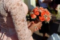 Stylish bridesmaids in pink lace dress holding amazing bouquets