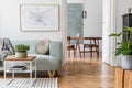 Stylish, bright, Scandinavian living room and dining room. Royalty Free Stock Photo