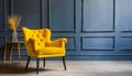 Stylish bright yellow chair against a dark gray wall. Stylish chair on wall background Royalty Free Stock Photo
