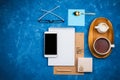 Stylish business flatlay mockup with notebook, glasses, pencil, milk holder and tea on wooden tray and smartphone