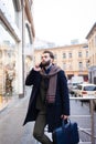 Stylish business man with a beard talking on the phone with business partners Royalty Free Stock Photo