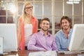 Stylish business people sitting by computer