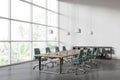 Stylish business room interior with meeting board and chairs, panoramic window Royalty Free Stock Photo