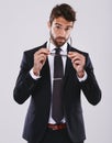 Stylish business. Studio shot of a handsome and well-dressed young man. Royalty Free Stock Photo