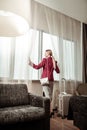 Stylish businesswoman studying hotel room having business trip Royalty Free Stock Photo