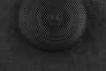 Car audio speaker with protector cover on black background Royalty Free Stock Photo