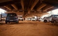 Cars parked under a flyover bridge in Bangalore India unique photo Royalty Free Stock Photo