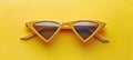 Stylish cat eye sunglasses with thick frame and tinted glass isolated on yellow background Royalty Free Stock Photo