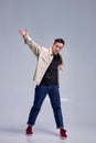 stylish man dressed in stylish clothes is dancing street dance. handsome male dancer Royalty Free Stock Photo