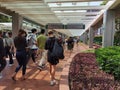 25 10 2021 stylish and cheerful male female students with face mask walk in corridor or sheltered university street paved by red