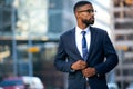 Stylish chic modern style business suit executive, african american male commercial model, walking to swanky office workplace Royalty Free Stock Photo