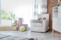 Stylish child room interior with armchair Royalty Free Stock Photo