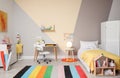 Stylish child room interior with bed and desk Royalty Free Stock Photo