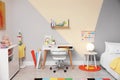 Stylish child room interior with bed and desk