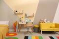 Stylish child room interior with bed and desk Royalty Free Stock Photo