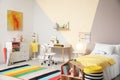 Stylish child room interior with bed and desk Royalty Free Stock Photo