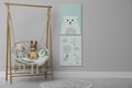 Stylish child`s room with adorable paintings and hanging chair. Space for text