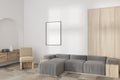 Stylish chill room interior with sofa and armchair, drawer and mockup frame