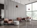 Stylish chill zone interior with armchairs in business room, panoramic window