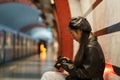 Fashionable asian photographer girl watch picture on camera after walk in city wait for subway train Royalty Free Stock Photo