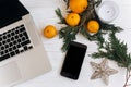 Stylish christmas flat lay. laptop and phone with empty screen o Royalty Free Stock Photo