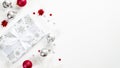 Stylish Christmas gift wit red and silver balls and decorations on white background. Flat lay, top view, copy space. Christmas Royalty Free Stock Photo