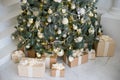 Stylish Christmas interior decorated in white and golden colors