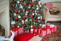 Stylish Christmas interior decorated in white and red colors Royalty Free Stock Photo