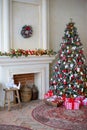 Stylish Christmas interior decorated in white and red colors Royalty Free Stock Photo