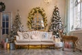 Stylish Christmas interior with an elegant sofa Royalty Free Stock Photo