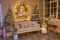 Stylish Christmas interior with an elegant sofa Royalty Free Stock Photo