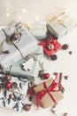 Stylish christmas wrapped presents with ornaments and lights on Royalty Free Stock Photo