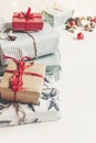 Stylish christmas wrapped presents with ornaments and lights on Royalty Free Stock Photo