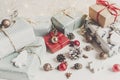 Stylish christmas wrapped presents with ornaments and lights on Royalty Free Stock Photo