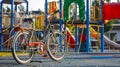 A stylish city bike with a child seat, parked near a modern playground with colorful equipment Royalty Free Stock Photo