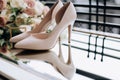 Stylish classic beige bridal shoes for a wedding ceremony. Wedding accessories Royalty Free Stock Photo